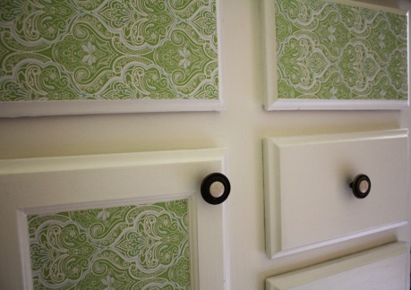Green damask contact paper on the cabinets, because it looks fun.